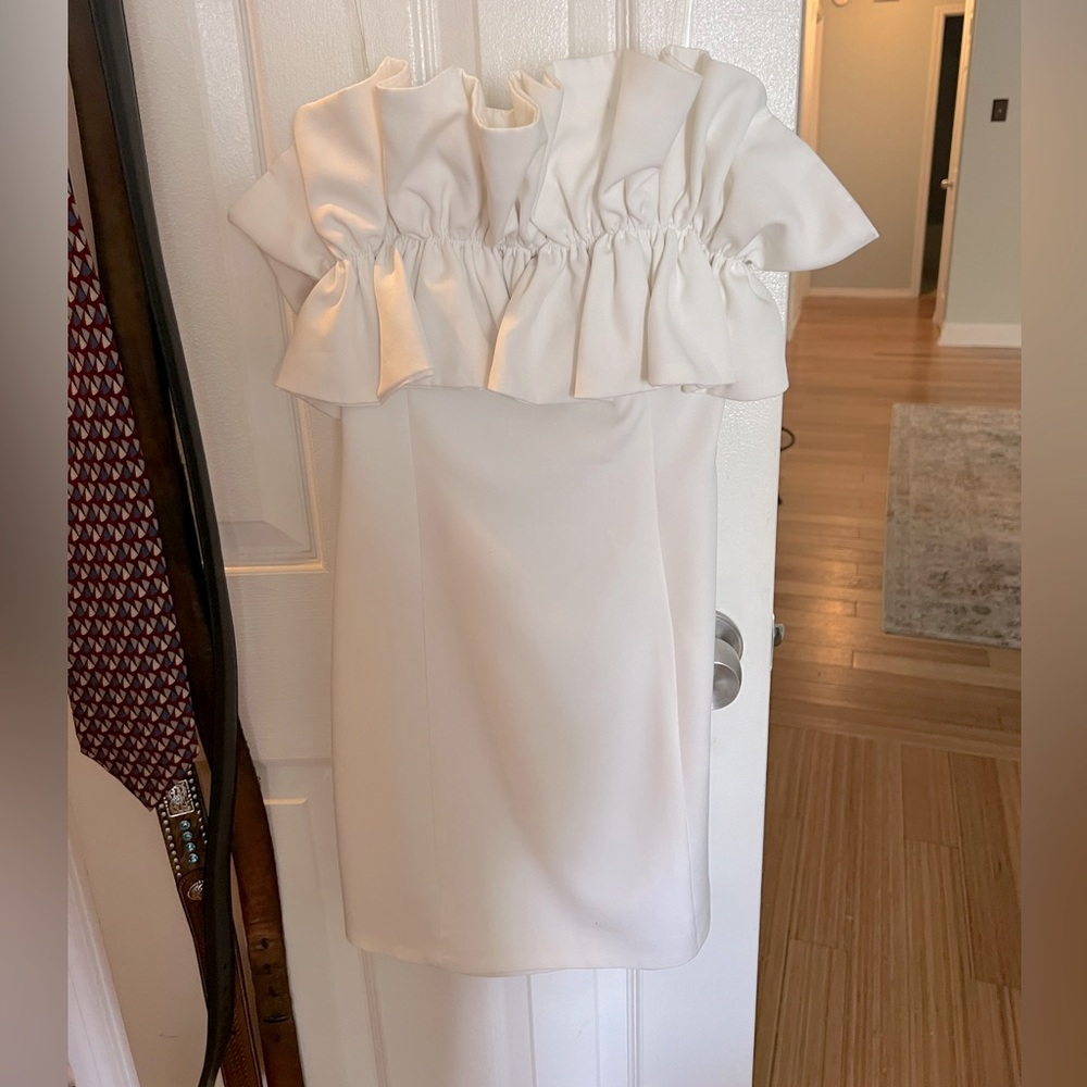 White, short, form-fitting dress from a boutique